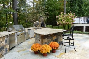 Earthscapes custom outdoor living service of a grill, barbeque pit, and outdoor kitchen with beautiful masonry work