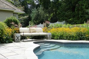 Earthscapes outdoor living remodeling services of a pool and patio design in New Canaan, CT