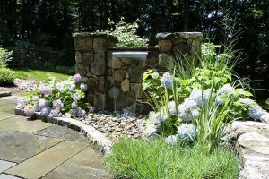 Earthscapes custom masonry service with waterfall for home in Darien, CT